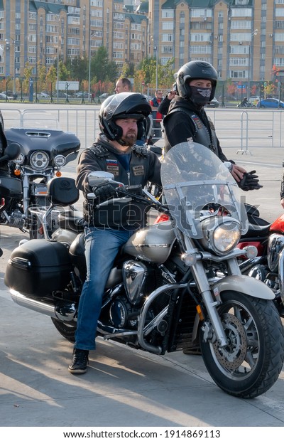 Kazan, Russia-September\
26, 2020: Two bikers in the parking lot at a meeting for a joint\
biker ride through the streets of the city, waiting for the start\
of the trip