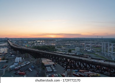 Kearny, New Jersey - July 14, 2019:  Aerial view of the Pulaski Skyway (US Route 1/9) at sunset, and the industrial structures surrounding it.