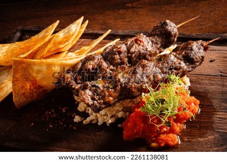 kebab with chips and sauce