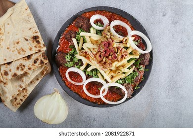 Kebab Kishkash On Tomato Sauce, Onion And Bread Iraqi Food