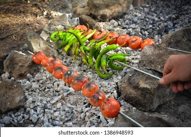 kebabs, tomatoes, peppers and meat with fire as a result of the result. - Shutterstock ID 1386948593