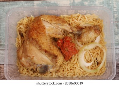 Kebuli Rice Or Nasi Kebuli With Fried Chicken On The Table