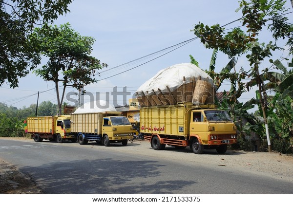 Kebumen,\
Indonesia - August, 2015: An overloaded truck is parked on the side\
of the road in Sempor, Kebumen,\
Indonesia.