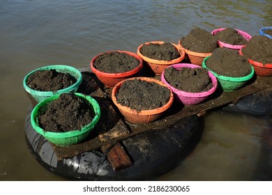 Kebumen, Indonesia - May, 2017: Sand In A Plastic Basket Traditionally Mined From The River.