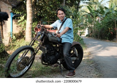 Kebumen, Indonesia - May, 2018: A Man Takes A Picture On A Chopper Motorbike.