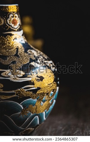 Kebumen, Indonesia - September 2023, Chinese antique vase or jar dragon artistic painting.
