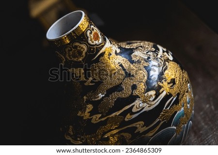 Kebumen, Indonesia - September 2023, Chinese antique vase or jar dragon artistic painting.