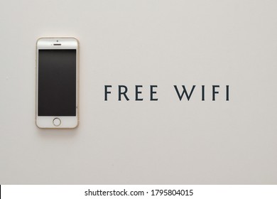 Kedah, Malaysia - August 13 2020 : An Image Of IPhone 6 Plus Isolated On White Background With FREE WIFI Words. Image Can Be Used For Signage Board. 