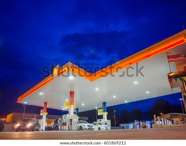 Kedah, Malaysia\
- February 27, 2017: Shell gas station blue sky background during\
sunset. Royal Dutch Shell sold its Australian Shell retail\
operations to Dutch company Vitol in\
2014