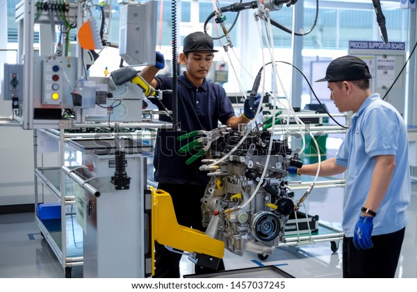KEDAH, MALAYSIA - JULY 04, 2019 :\
Workers at engine assembly plant. Catering for both the domestic\
and export markets. Automotive &\
technology.