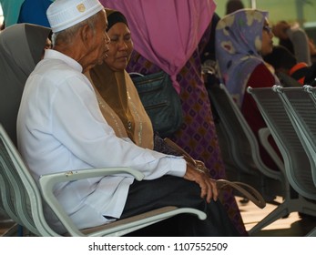 KEDAH, MALAYSIA, MAY 27th 2018 - Malay Older Couple Chatting While Waiting For Their Flight Boarding At Alor Star Airport, Malaysia.