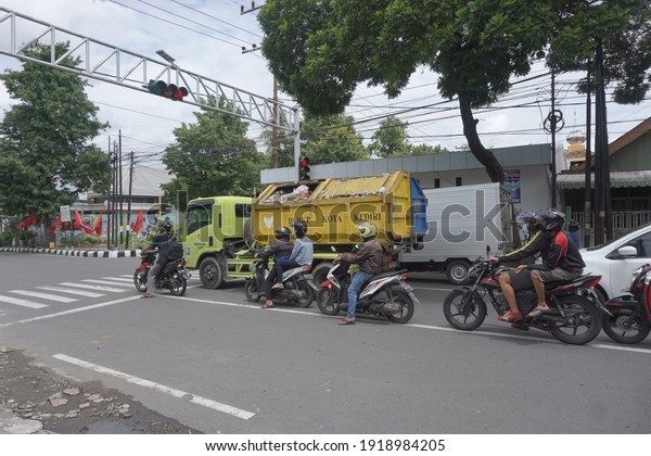 Kediri, East Java, Indonesia -\
February 16th, 2021: Vehicle on the road with a natural\
background