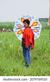 Kediri, East Java, Indonesia - November 21st, 2021 : The Participant Of The Indonesian Kites Festival And Their Kite With Hexagon Shape