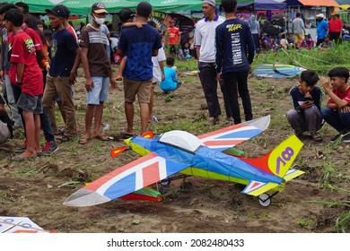 Kediri, East Java, Indonesia - November 21st, 2021 : The Participant Of The Indonesian Kites Festival And Their Kite With Plane Shape