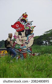 Kediri, East Java, Indonesia - November 21st, 2021 : The Participant Of The Indonesian Kites Festival And Their Kite With Wayang Shape