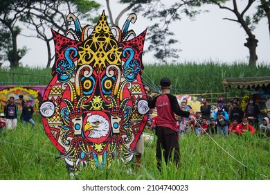 Kediri, East Java, Indonesia - November 21st, 2021 : The Participant Of The Indonesian Kites Festival And Their Kite With Batik Motif