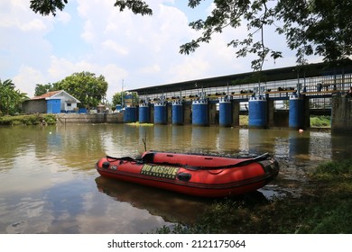 KEDIRI, INDONESIA - February 10, 2022: people wearing life jackets and riding inflatable boats on the river doing rafting