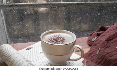 Kediri, Indonesia - May 2021: A Cup Of Cappuccino On A Page Of Book  From ‘The Great Gatsby By F. Scott Fitzgerald’