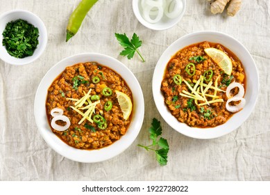Keema curry in bowl over light background. Indian and pakistani style dish. Top view, flat lay