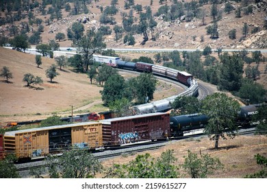Keene California, May 10, 2022: The Tehachapi Loop where Trains Cross over themselves to Climb a Steep Grade with 2 Trains Crossing together Time Lapse