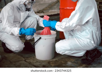 Keep Chemicals in Toxic Waste Red Bag and Thick Plastic Barrels for Disposal, Dispose of Material Safely. Clean up Chemical Liquid Spill. Part of Basic Practical Training for Chemical Spill.