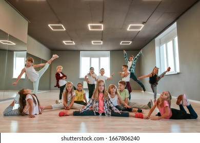 Keep Dancing. Group Of Happy Little Boys And Girls In Fashionable Clothes Posing Together In The Dance Studio. Dance Team. Hip Hop