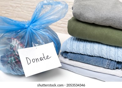 Keep And Donate Clothes, A Plastic Bag Of Used Warm Clothes For Donation, Giving For Free.