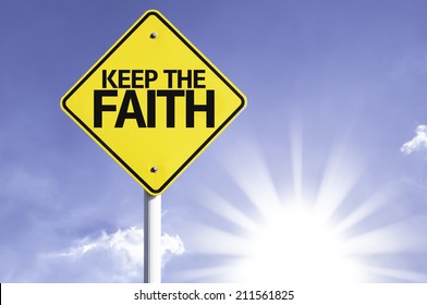 Keep the Faith road sign with sun background 