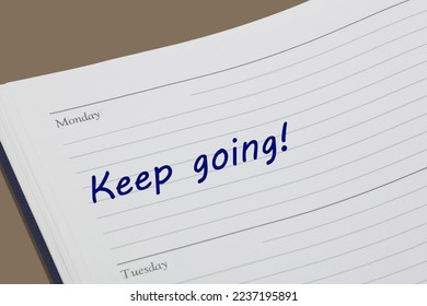 Keep going diary reminder message open on desk