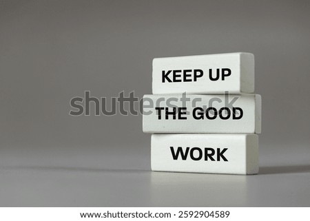 Keep up the good work, text is written on wooden blocks, Business concept, Motivating slogan, work commitment, good job. copy space, grey background