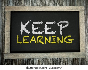 Keep Learning written on chalkboard