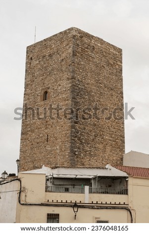 Keep of the low fortress of Martos in Spain from the Middle Ages, surrounded by houses.