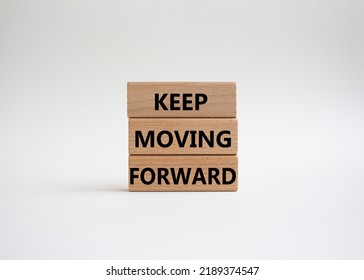 Keep Moving Forward Symbol. Concept Words Keep Moving Forward On Wooden Blocks. Beautiful White Background. Business And Keep Moving Forward Concept. Copy Space.