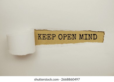 Keep Open Mind message written on craft paper with torn paper background