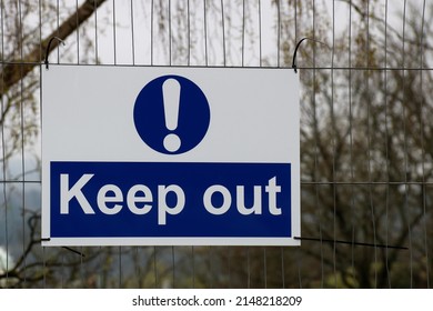 Keep Out Sign Hanging On A Building Site Perimeter Fence