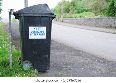 Keep Roads Litter Free Sign At Roadside On Wheelie Bin