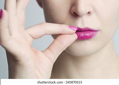 Keep a secret, Woman zipping her mouth shut - keeping quiet concept