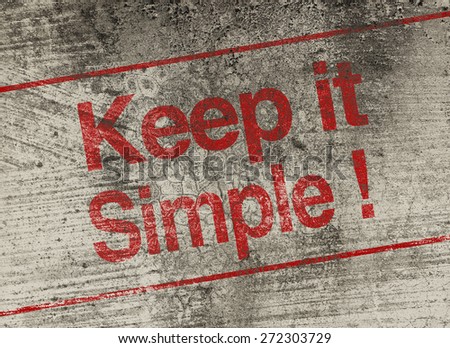 Keep it simple concept text is painted on old fashion wall.