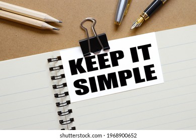 Keep it simple . the inscription on the business card is attached to the notebook.