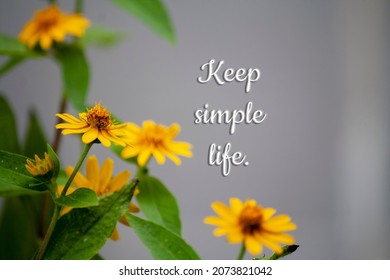 Keep simple life  wording motivation and blur yellow butter flower background