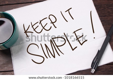 Keep it Simple. Motivational inspirational quotes words. Wooden background
