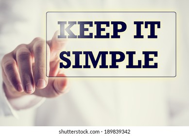 Keep It Simple In A Navigation Bar On A Virtual Screen With A Businessman Touching It To Activate It From Behind Conceptual Of Simplicity, Clarity And Easy Understanding In Business And In Life.