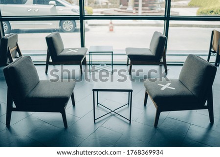 Keep space between each chairs in public away from others for social distancing, increasing space between people to avoid spreading of COVID-19. Social distance concept.