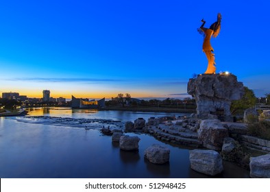 Keeper Of The Plains Indian In Wichita, Kansas At Sunrise. A Steel Sculpture By Blackbear Bosin That Stands At The Fork Of The Arkansas River.