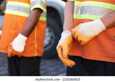 Keeping the city clean. Cropped shot of a team of garbage collectors. - Shutterstock ID 2231063425