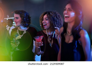 Keeping A Close Eye On The Dancefloor. Shot Of A Group Of Friends Enjoying Themselves At A Nightclub.