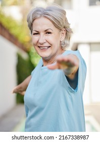 Keeping Fit With Yoga. Shot Of A Senior Woman Doing Yoga Outside In Her Yard.