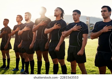 Keeping national pride. a diverse group of sportsmen standing together and singing their national anthem before playing rugby. - Powered by Shutterstock