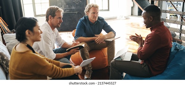 Keeping their creative ideas flowing. Shot of a diverse group of designers brainstorming together in an office. - Shutterstock ID 2137445527