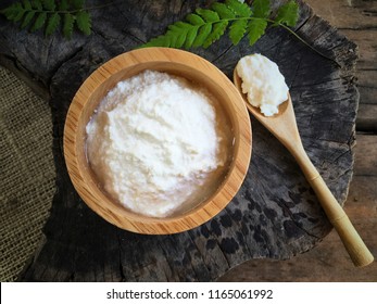 Kefir Grains In Bowl And Spoon On Wooden Table, Soft Focus.